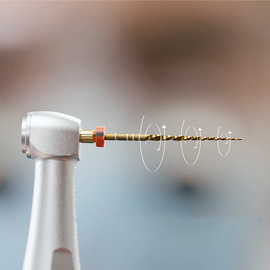 WaveOne Gold file in a contra-angle handpiece showing the reciprocating motion