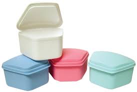 Denture storage container cases in assorted colours