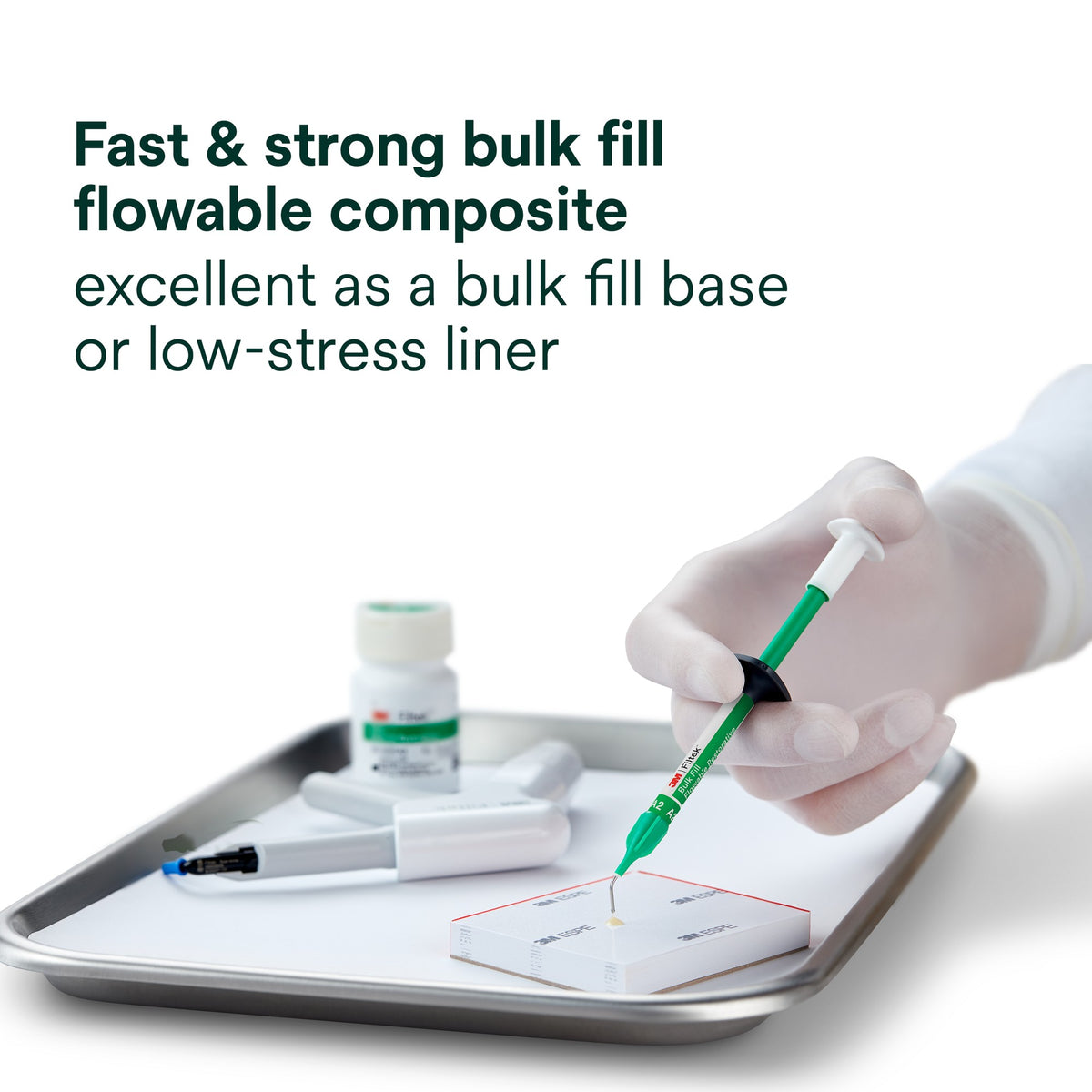 3M Filtek Bulk Fill Flowable Restorative syringe in use as a bulk fill base